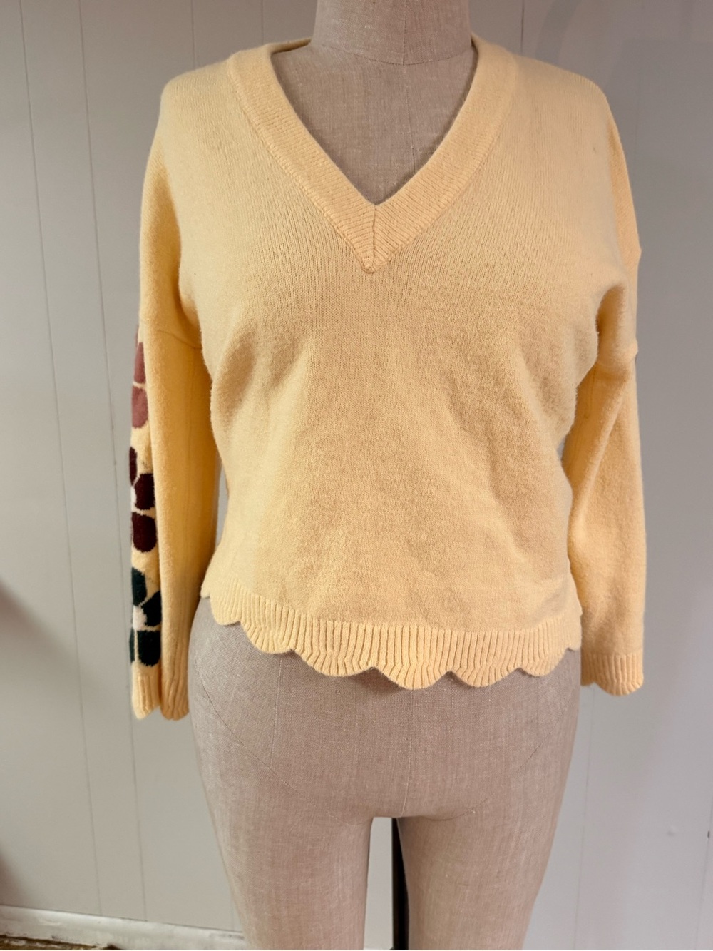 Women's V-Neck Scalloped Hem Sweater in Soft Yellow with Floral Sleeve Detail